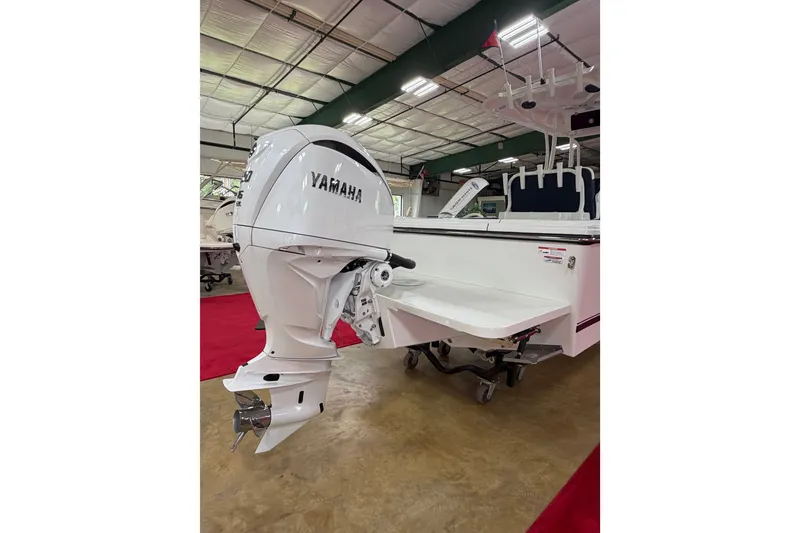 Slide: The Image of 2027 Parker 240 Coastal Elite boat with Yamaha outboard motor in showroom. - 3