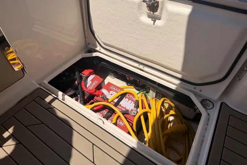 Slide: The Image of 2022 Cutwater C-24 Coupe battery compartment with cables and lithium batteries. - 5