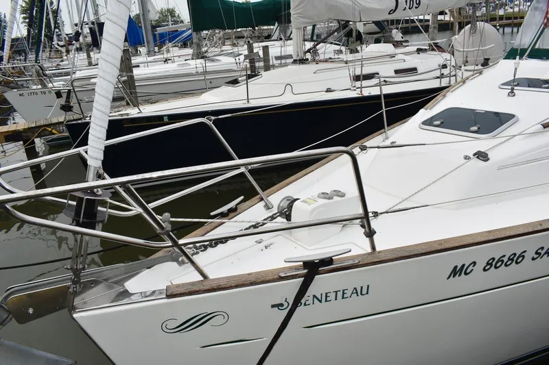 Slide: The Image of 1999 Beneteau Oceanis 36 CC sailboat docked in marina, showcasing sleek design. - 3