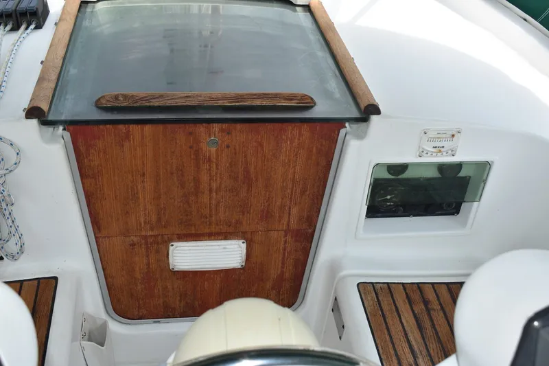 Slide: The Image of Cockpit of 1999 Beneteau Oceanis 36 CC with wooden accents and seating. - 20