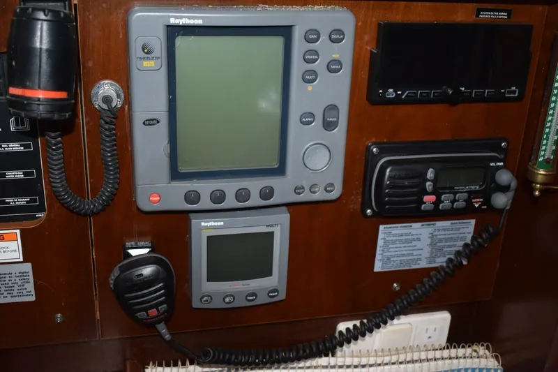 Slide: The Image of Control panel of a 1999 Beneteau Oceanis 36 CC sailboat with navigation equipment. - 42