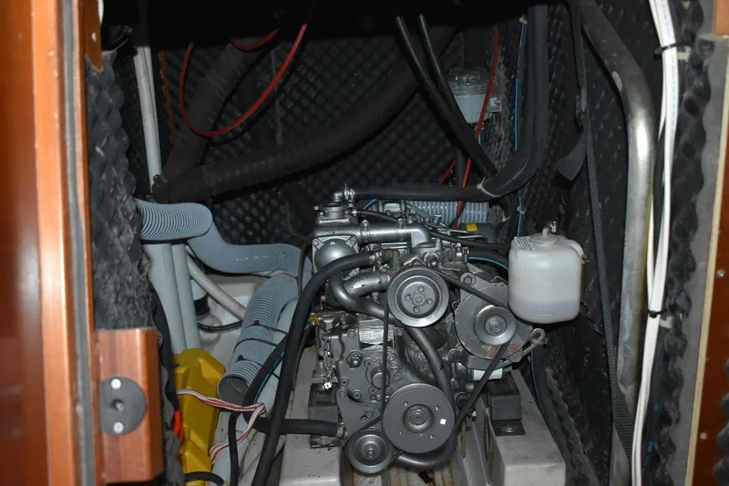 Slide: The Image of Engine compartment of a 1999 Beneteau Oceanis 36 CC sailboat, showcasing mechanical components. - 50