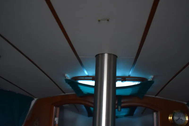 Slide: The Image of Interior view of 1999 Beneteau Oceanis 36 CC sailboat, featuring ceiling and porthole. - 32