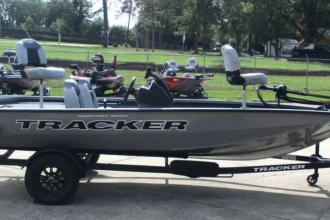 Slide: The Image of 2027 Tracker Pro Team 175 fishing boat on trailer, parked outdoors. - 3