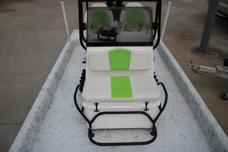 Slide: The Image of 2018 Shallow Stalker 204 RC boat with green and white seating, steering console visible. - 12