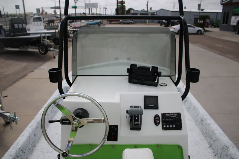 Slide: The Image of 2018 Shallow Stalker 204 RC boat console with steering wheel and controls. - 9