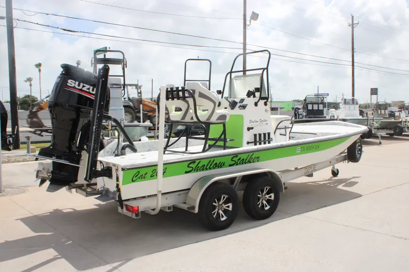 Slide: The Image of 2018 Shallow Stalker 204 RC boat with Suzuki outboard motor on trailer. - 3