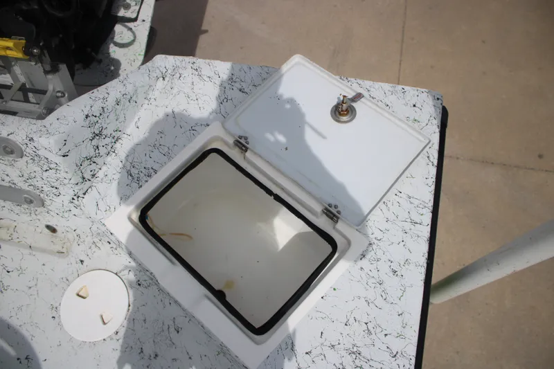 Slide: The Image of Open hatch on 2018 Shallow Stalker 204 RC boat, showing interior compartment. - 13