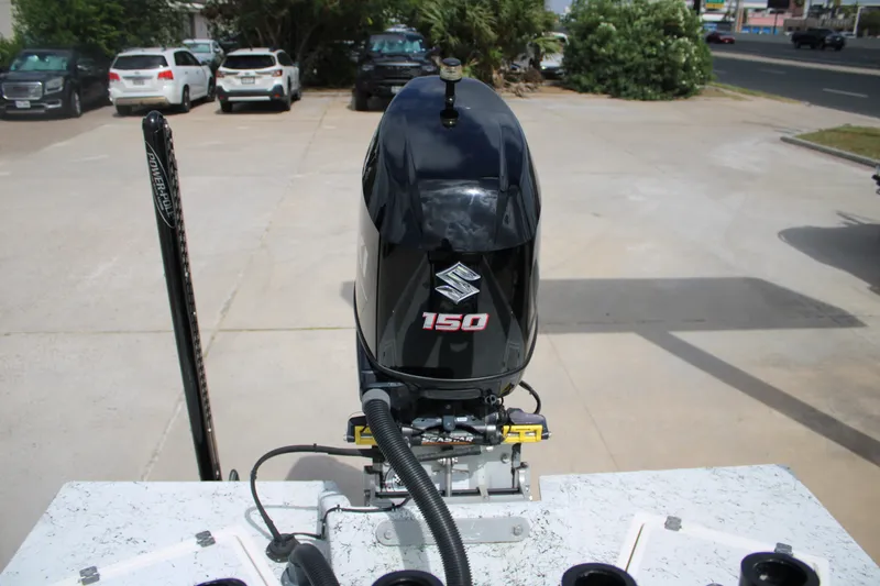 Slide: The Image of 2018 Shallow Stalker 204 RC boat with Suzuki 150 outboard motor in parking lot. - 10