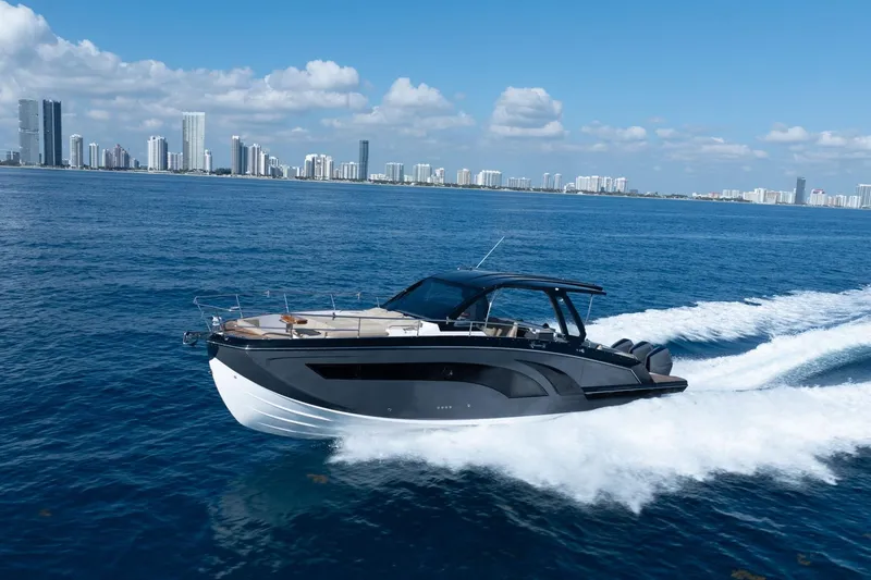 The Image of Luxury Hanover 447 yacht cruising near city skyline, 2026 model. - 2