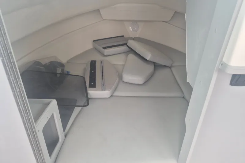 Slide: The Image of Interior cabin of 2027 Arima Sea Ranger 21 Yellowtail Edition boat, featuring cushioned seating. - 23