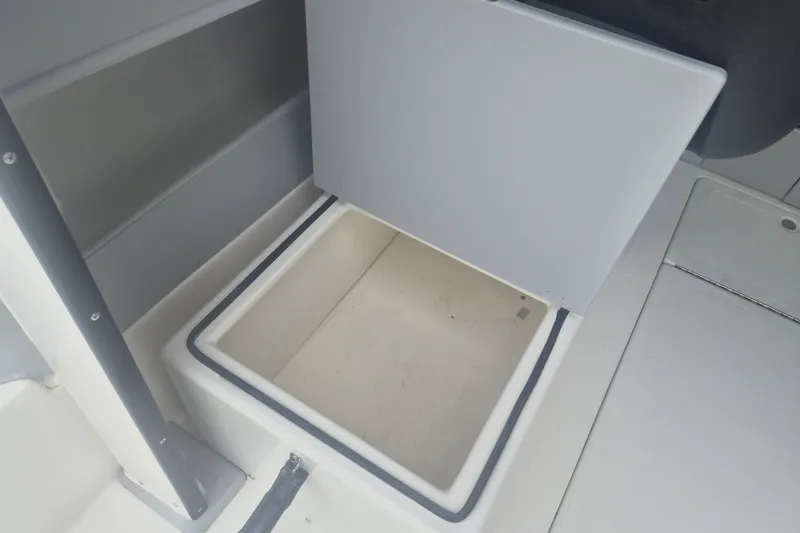 Slide: The Image of Open storage compartment on 2027 Arima Sea Ranger 21 Yellowtail Edition boat. - 14