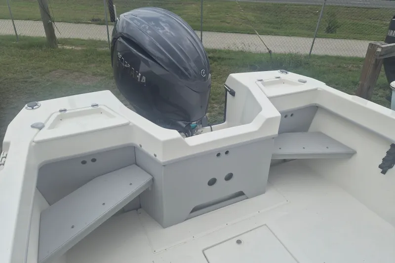 Slide: The Image of 2027 Arima Sea Ranger 21 Yellowtail Edition boat with powerful outboard motor. - 9
