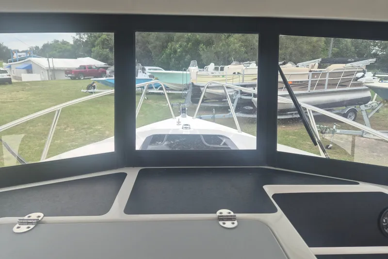 Slide: The Image of Interior view from Arima Sea Ranger 21 Yellowtail Edition, showcasing the bow and surrounding boats. - 16