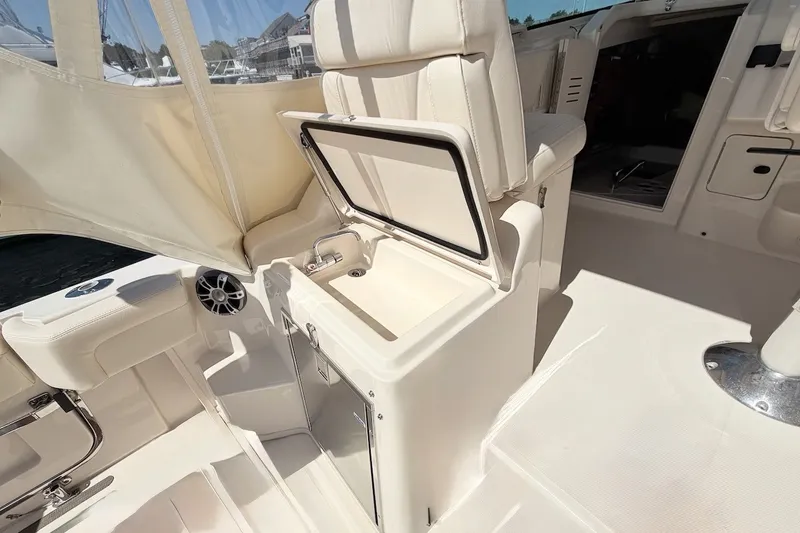 Slide: The Image of 2023 Grady-White Express 330 boat interior with sink and seating area. - 43