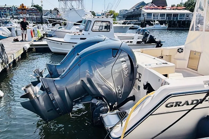 Slide: The Image of 2023 Grady-White Express 330 boat with Yamaha outboard engines docked at marina. - 44