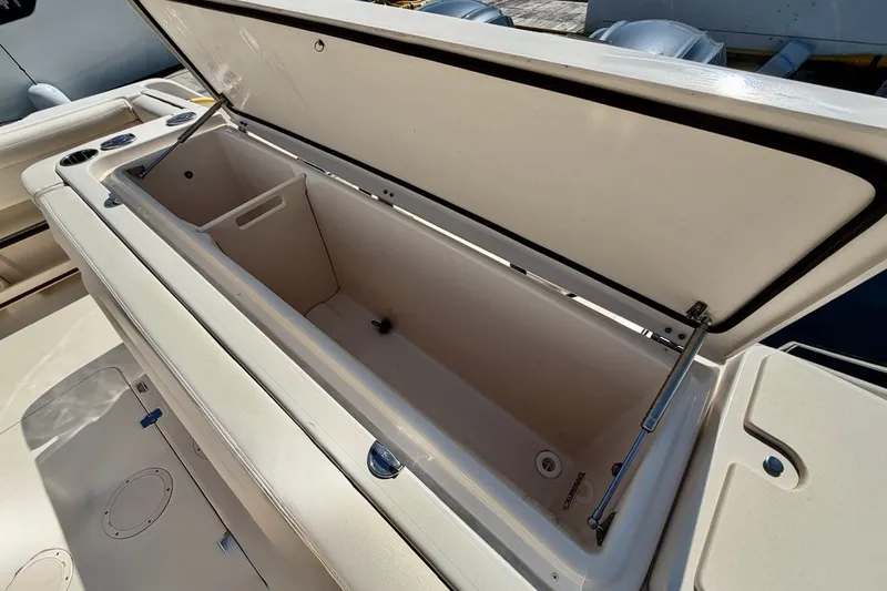 Slide: The Image of Open storage compartment on 2023 Grady-White Express 330 boat, showcasing spacious interior design. - 33