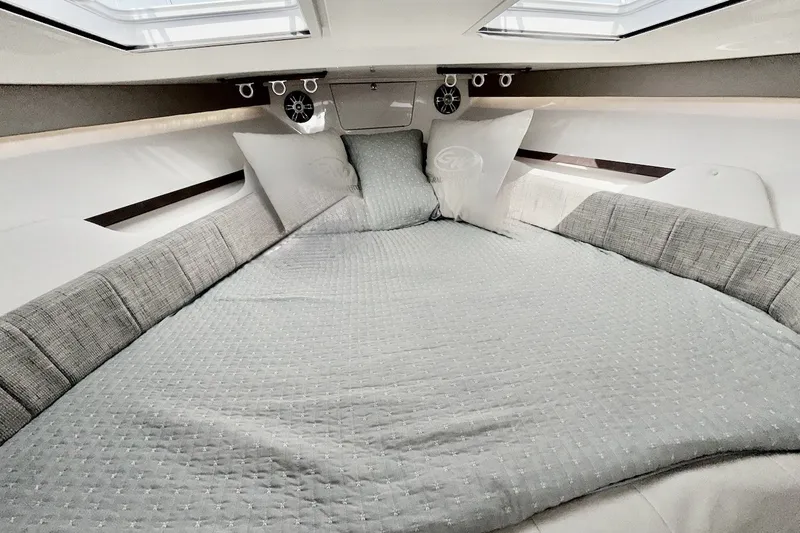 Slide: The Image of Luxurious cabin interior of 2023 Grady-White Express 330 with comfortable bedding. - 10