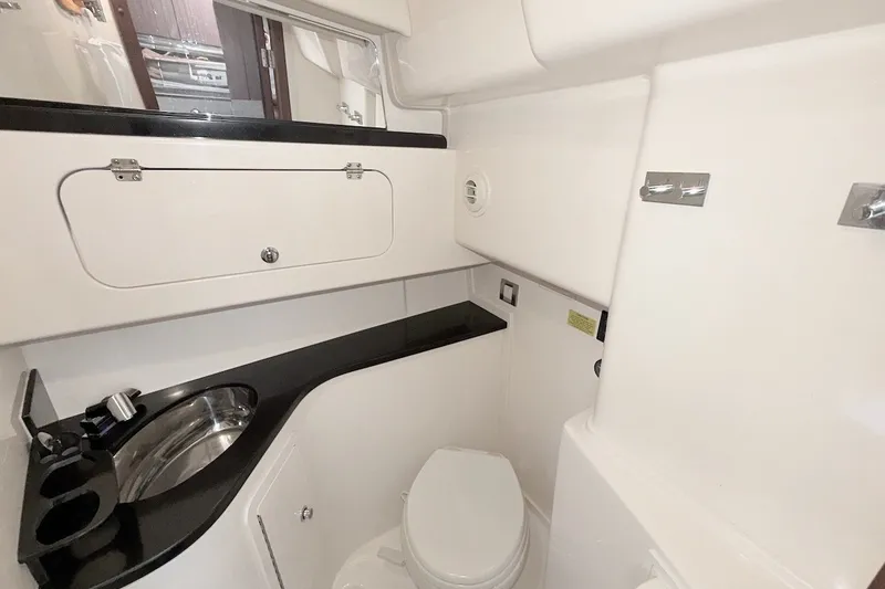 Slide: The Image of 2023 Grady-White Express 330 boat bathroom with sink and toilet. - 12