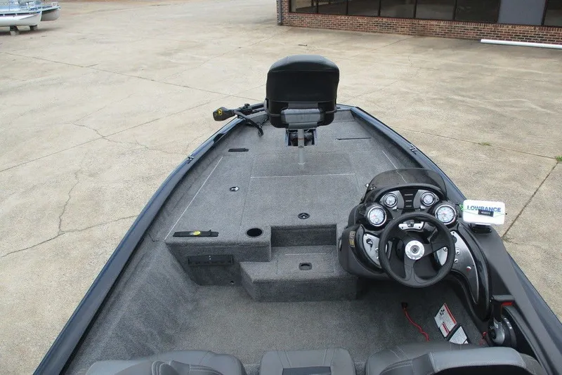 Slide: The Image of 2019 Tracker Pro Team 175 TXW boat interior with steering console and seating. - 6