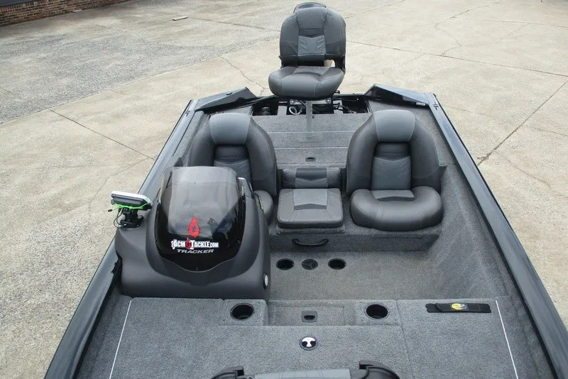 Slide: The Image of 2019 Tracker Pro Team 175 TXW boat interior with gray seating and carpeted deck. - 7