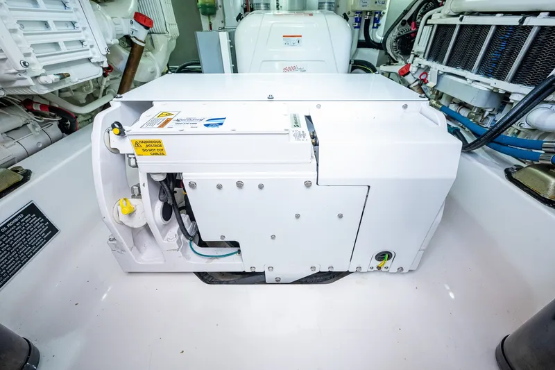 Slide: The Image of Engine room of 2021 Palm Beach Motor Yachts PB55, showcasing mechanical components and systems. - 45