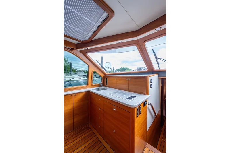 Slide: The Image of Luxurious 2021 Palm Beach Motor Yachts PB55 interior with sleek wood cabinetry and modern design. - 26