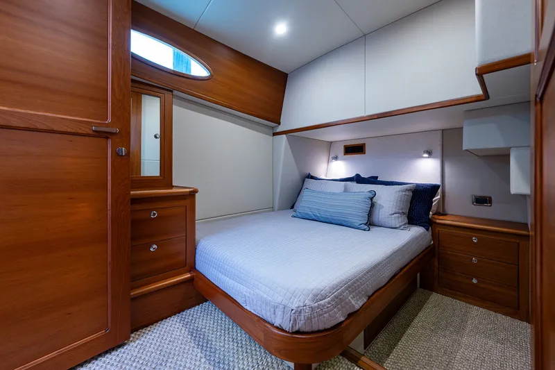 Slide: The Image of Luxurious cabin interior of 2021 Palm Beach Motor Yachts PB55 with elegant wood finish. - 34
