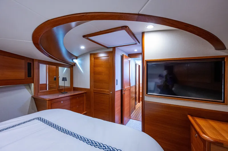 Slide: The Image of Luxurious 2021 Palm Beach Motor Yachts PB55 cabin interior with elegant wood finishes and modern amenities. - 29