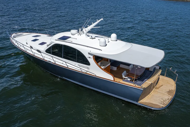 The Image of 2021 Palm Beach Motor Yachts PB55 cruising on open water, showcasing sleek design and luxury features. - 0