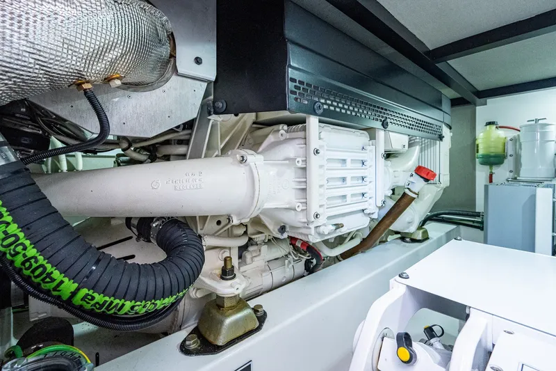 Slide: The Image of Engine room of 2021 Palm Beach Motor Yachts PB55, showcasing mechanical components and systems. - 44