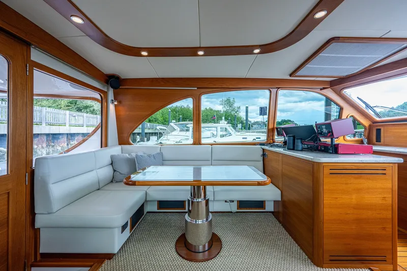 Slide: The Image of Luxurious interior of 2021 Palm Beach Motor Yachts PB55 with elegant wood and leather finishes. - 19