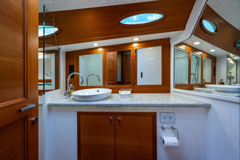 Slide: The Image of Luxurious bathroom interior of 2021 Palm Beach Motor Yachts PB55, featuring elegant wood finishes. - 33