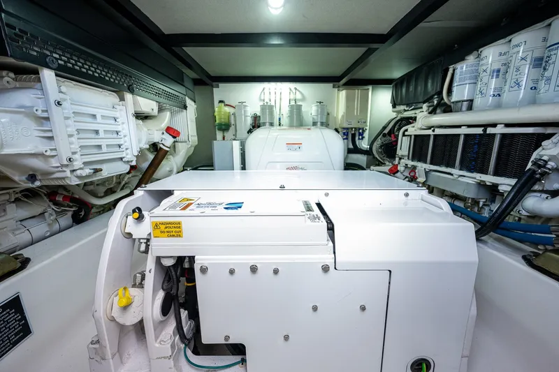 Slide: The Image of Engine room of 2021 Palm Beach Motor Yachts PB55, showcasing mechanical components and systems. - 40