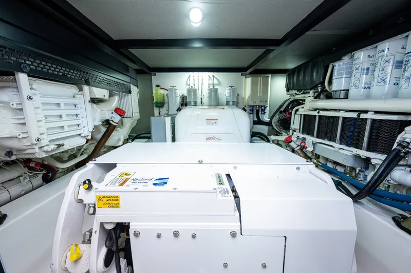Slide: The Image of Engine room of 2021 Palm Beach Motor Yachts PB55, showcasing advanced machinery and equipment. - 46