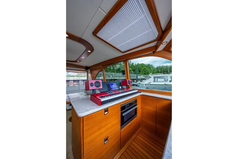Slide: The Image of Luxurious interior of 2021 Palm Beach Motor Yachts PB55 with modern kitchen and scenic view. - 25