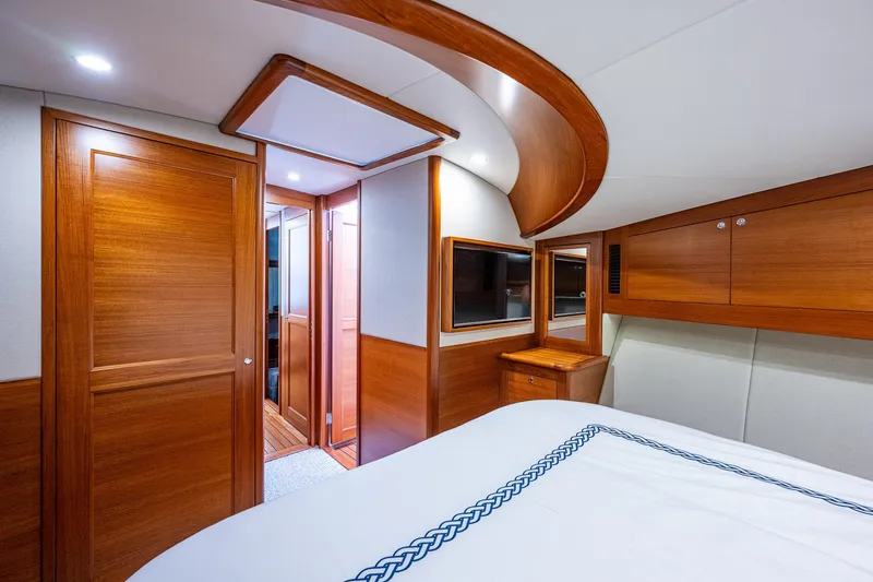 Slide: The Image of Luxurious cabin interior of 2021 Palm Beach Motor Yachts PB55 with elegant wood finish. - 27
