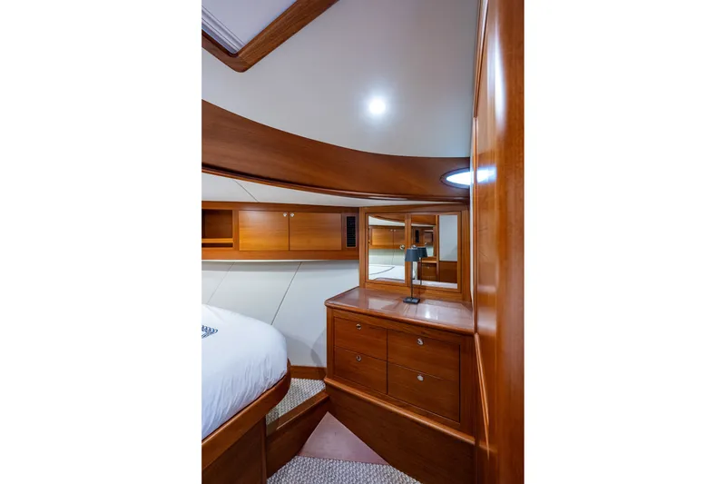 Slide: The Image of Luxurious wooden interior of 2021 Palm Beach Motor Yachts PB55 cabin with elegant furnishings. - 30