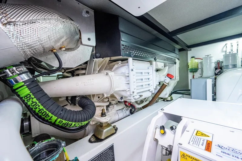Slide: The Image of Engine room of 2021 Palm Beach Motor Yachts PB55, showcasing mechanical components and systems. - 42