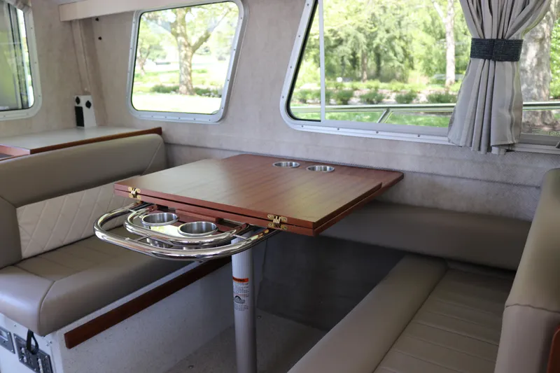 Slide: The Image of Interior of 2026 KingFisher 3425 GFX Offshore boat with dining area and windows. - 10