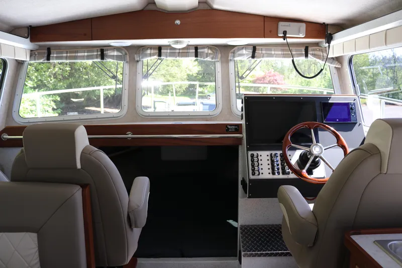 Slide: The Image of Interior of 2026 KingFisher 3425 GFX Offshore boat with modern helm and seating. - 6