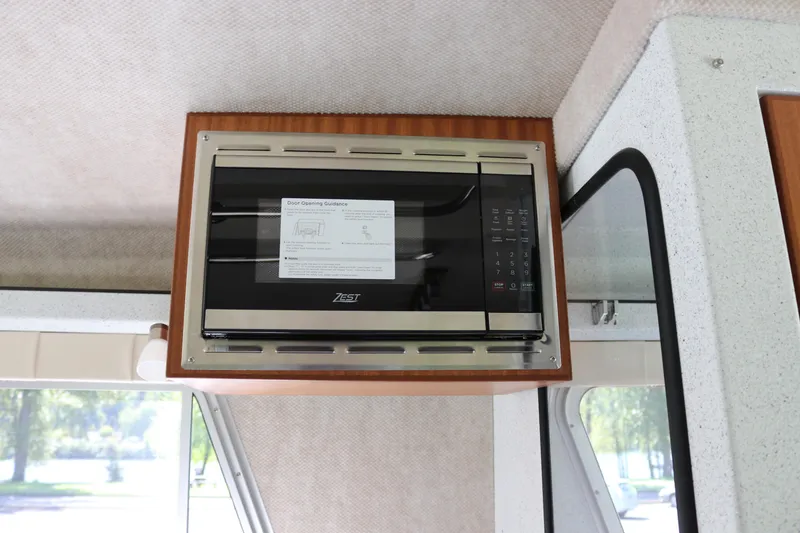 Slide: The Image of Built-in microwave in 2026 KingFisher 3425 GFX Offshore boat interior. - 20