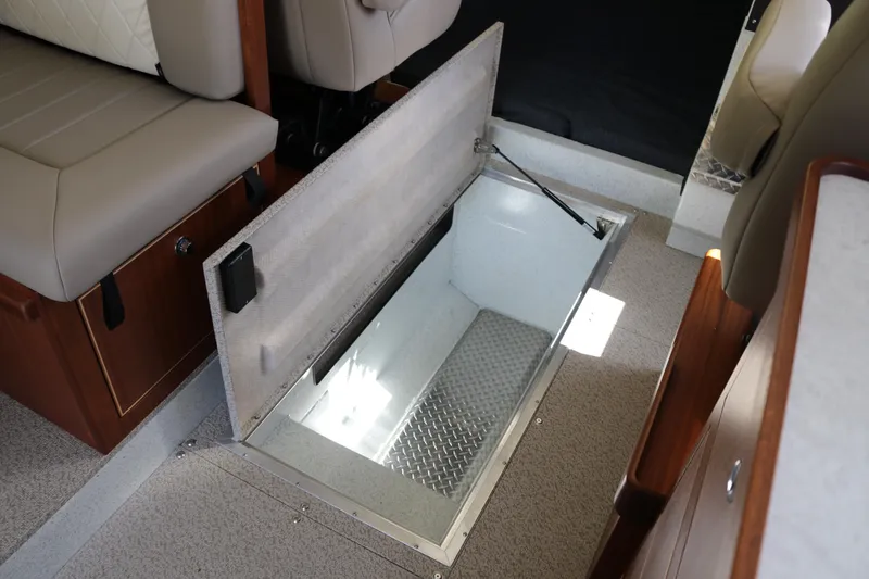 Slide: The Image of Open storage compartment in 2026 KingFisher 3425 GFX Offshore boat interior. - 18