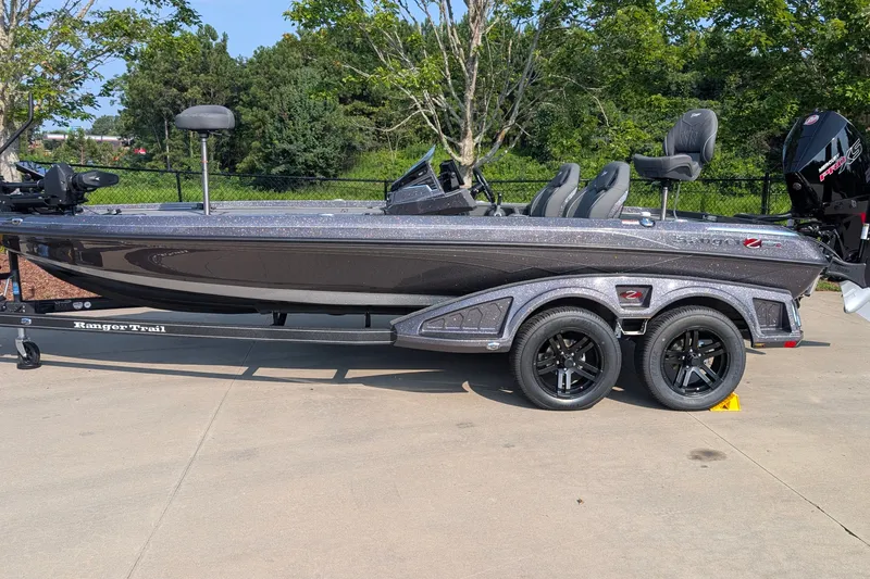 Slide: The Image of 2026 Ranger Z520R Ultra boat on trailer, parked outdoors, showcasing sleek design and modern features. - 1