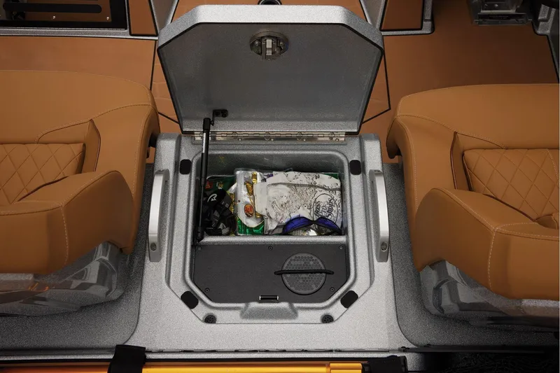 Slide: The Image of Manufacturer Provided Image: 2026 Ranger Z520R Ultra boat interior with open storage compartment between tan seats. - 48
