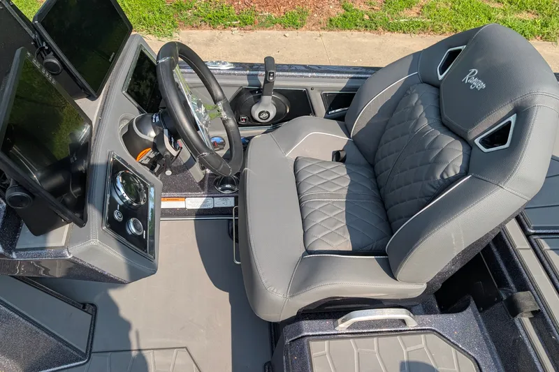 Slide: The Image of 2026 Ranger Z520R Ultra boat cockpit with modern controls and luxurious seating. - 13