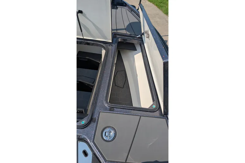 Slide: The Image of Open storage compartment of 2026 Ranger Z520R Ultra boat, showcasing interior design. - 8