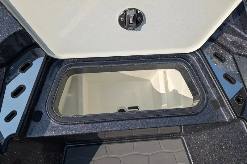 Slide: The Image of Open storage compartment on 2026 Ranger Z520R Ultra boat. - 10