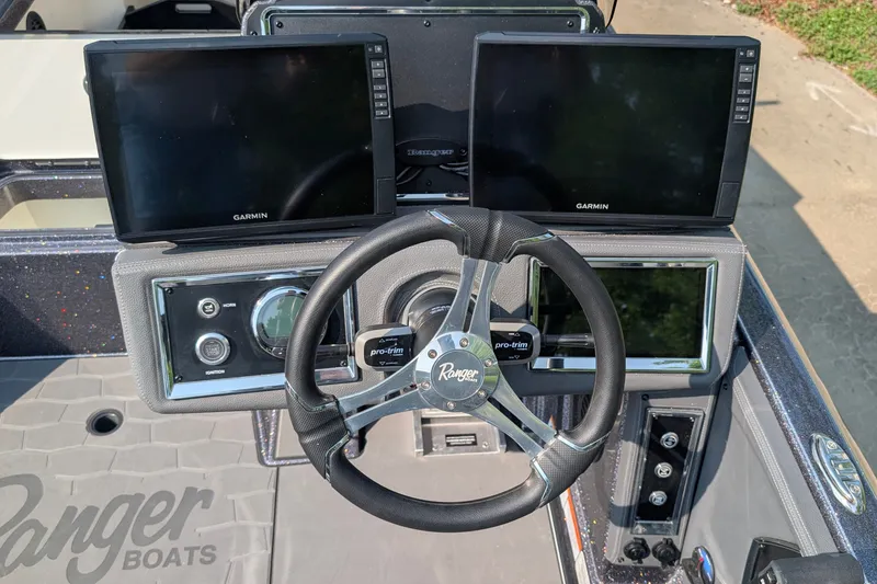 Slide: The Image of 2026 Ranger Z520R Ultra boat dashboard with dual Garmin displays and steering wheel. - 11