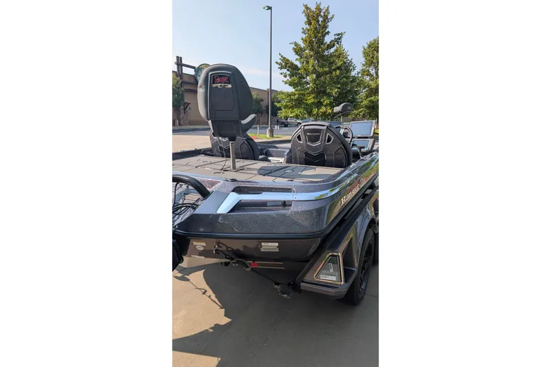Slide: The Image of 2026 Ranger Z520R Ultra boat, sleek design, parked outdoors, showcasing modern features. - 18